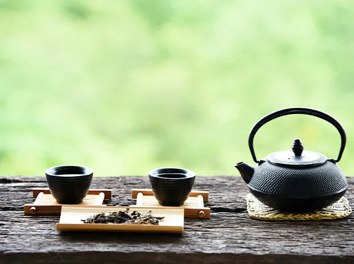 tea time with two cups and tea kettle