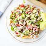 Nachos made with home-baked tortilla chips made from extra thin lower carb tortillas- you can have a whole dish and still eat light!