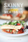 Meatball sub on a plate with salad with text overlay