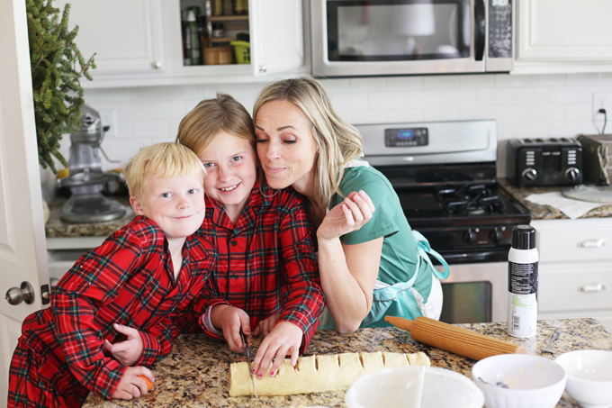Me and two of my kids baking giant cinnamon rolls for a christmas morning breakfast.
