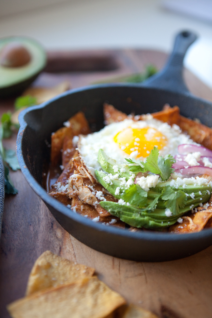 5 Minute Skinny Chilaquiles with toppings in a small cast iron skillet.
