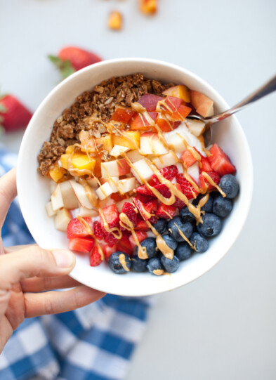 Picture of yogurt and cottage cheese breakfast bowl topped with colorful fruit.