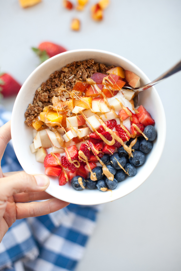 Picture of yogurt and cottage cheese breakfast bowl topped with colorful fruit.