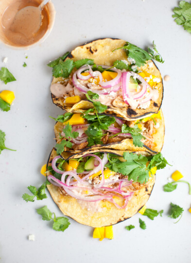 Instant pot chipotle chicken piled in tacos