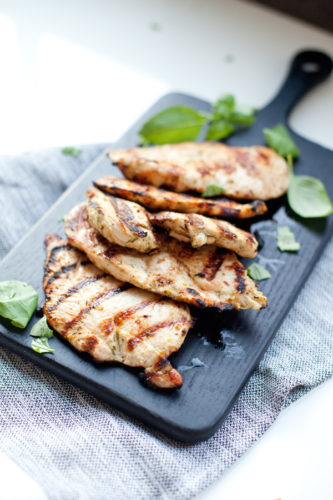 Grilled chicken on cutting board