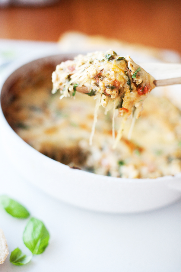 Taking a scoop of cheesy spaghetti squash bake.