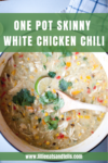 A pot of creamy one pot skinny white chicken chili with corn, beans, herbs, and a lime slice on top. A wooden spoon rests in the chili. Text reads: ONE POT SKINNY WHITE CHICKEN CHILI and www.lillieeatsandtells.com.