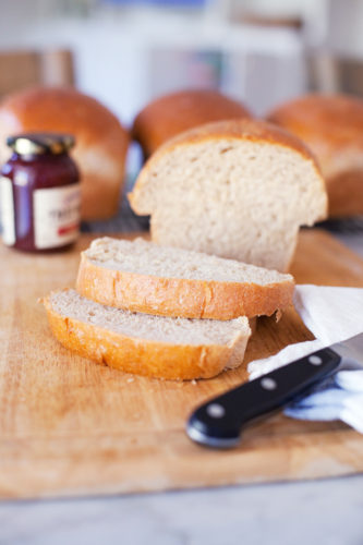 sliced loaf of homemade wheat bread