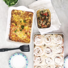 Breakfast casseroles and cinnamon rolls on the table