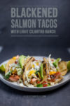 three salmon tacos on a plate