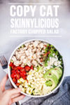 A bowl of chopped salad with diced chicken, avocado, corn, tomatoes, cheese, greens, and bacon bits. Text above reads: Copycat Factory Chopped Salad. A hand holds the bowl.