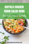 A bowl filled with buffalo chicken, brown rice, lettuce, cilantro, and pickled onions sits on a white surface with a spoon. Text reads: Easy Buffalo Chicken Grain Salad Bowl—low carb & macro-friendly.