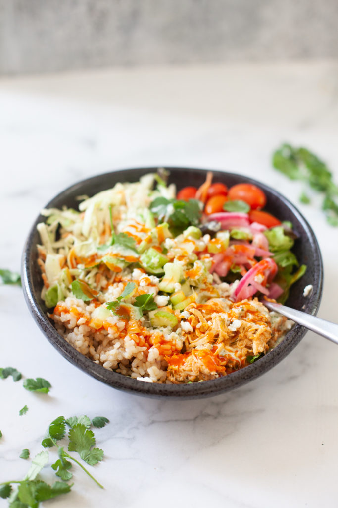 Quick and easy buffalo chicken grain salad bowl. www.lillieeatsandtells.com