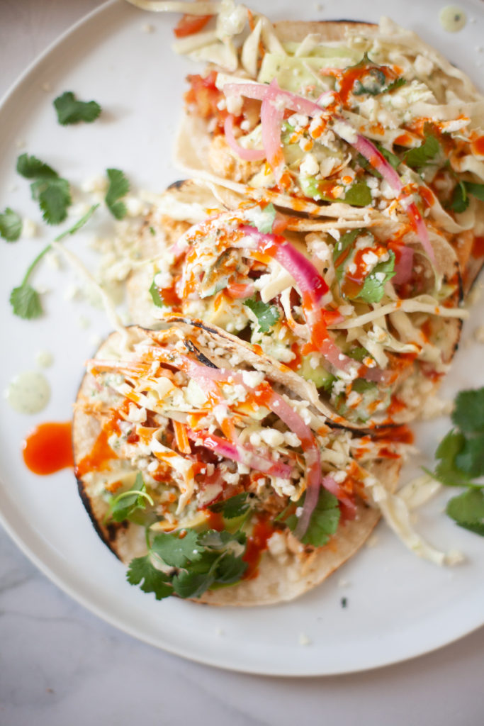 Try these buffalo chicken tacos with just the right kick. www.lillieeatsandtells.com