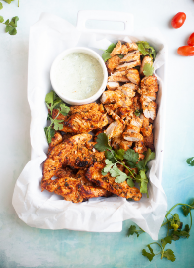 Cilantro lime air fryer chicken tenderloins in a serving dish.