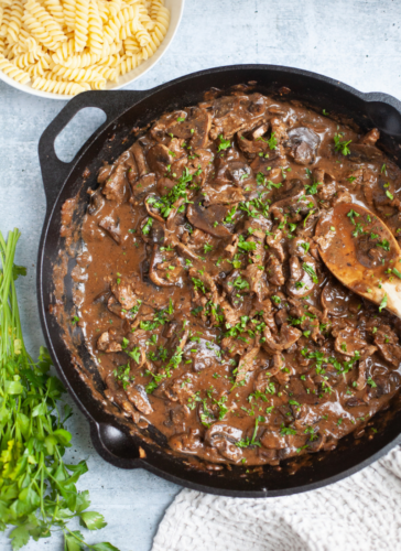 Beef stroganoff in a cast iron skillet.