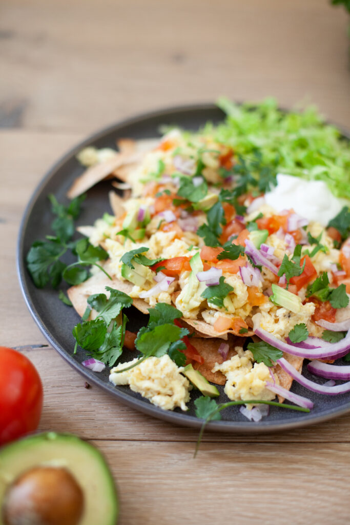 Nachos for breakfast. Eggs, cheese, and veggies is all you need. www.lilieeatsandtells.com