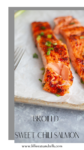 Two pieces of broiled sweet chili salmon garnished with herbs are arranged on parchment paper, with one piece of the sweet chili salmon flaked to reveal the moist interior. Text reads, BROILED SWEET CHILI SALMON.