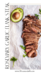 Sliced rosemary garlic flank steak rests on parchment paper, beautifully garnished with fresh parsley, with half an avocado nearby. The text reads “Rosemary Garlic Flank Steak,” along with a website at the bottom.
