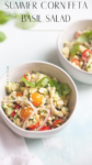 Two bowls of vibrant corn feta and basil salad, featuring cherry tomatoes, red onion, and fresh basil, sit on a light surface. The text Summer Corn Feta Basil Salad appears at the top of the image.