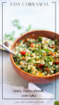 A wooden bowl filled with colorful corn salsa—including corn, tomatoes, herbs, and chopped vegetables—sits on a light surface with a spoon and parsley in the background. Text reads Fresh and Easy Corn Salsa and Quick, macro-friendly corn salsa.