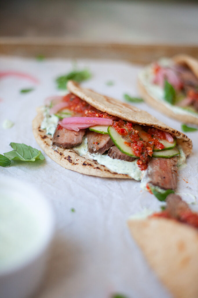 These steak and romesco sauce pitas are perfect for feeding a crowd! www.lillieeatsandtells.com