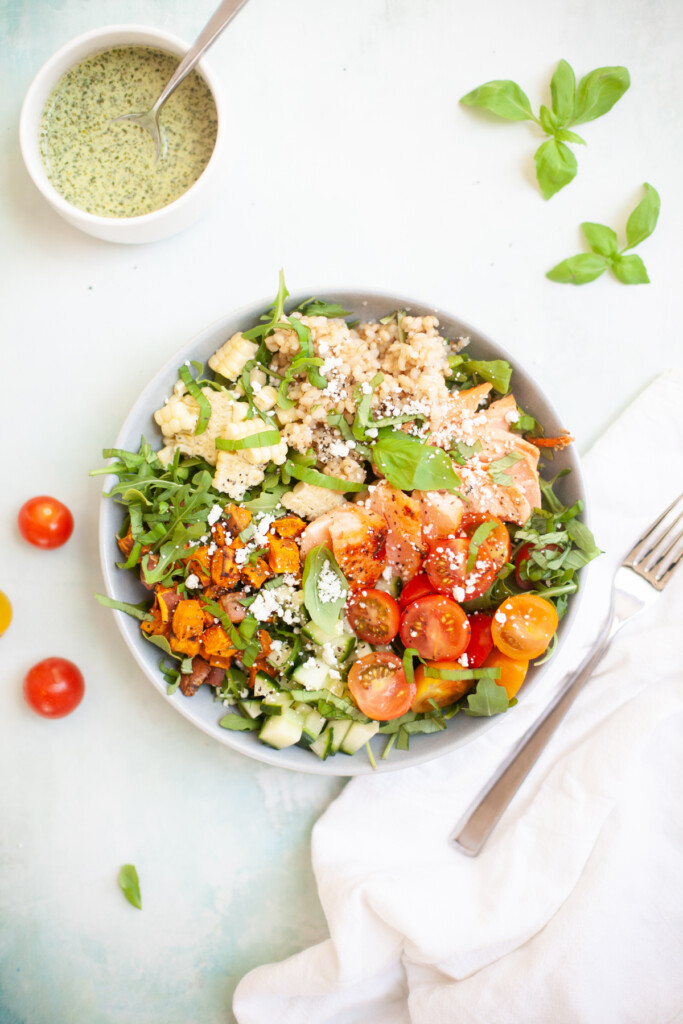 This salmon, sweet potato, and chimichurri salad will keep you full all afternoon. www.lillieeatsandtells.com