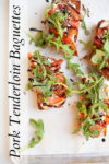 Toasted baguette slices topped with pork tenderloin, arugula, diced tomatoes, cheese, and a drizzle of balsamic glaze are arranged on parchment paper for a mouthwatering presentation. This appetizer draws inspiration from Pear Blue Cheese and Pork Baguettes, offering a delicious balance of savory and fresh flavors. “Pork Tenderloin Baguettes” text runs vertically on the left.