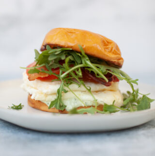 Quick tuscan egg white sandwich on a plate.