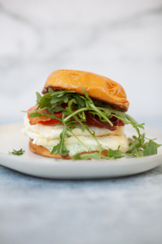 Quick tuscan egg white sandwich on a plate.