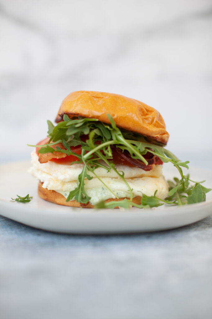 Quick tuscan egg white sandwich on a plate.