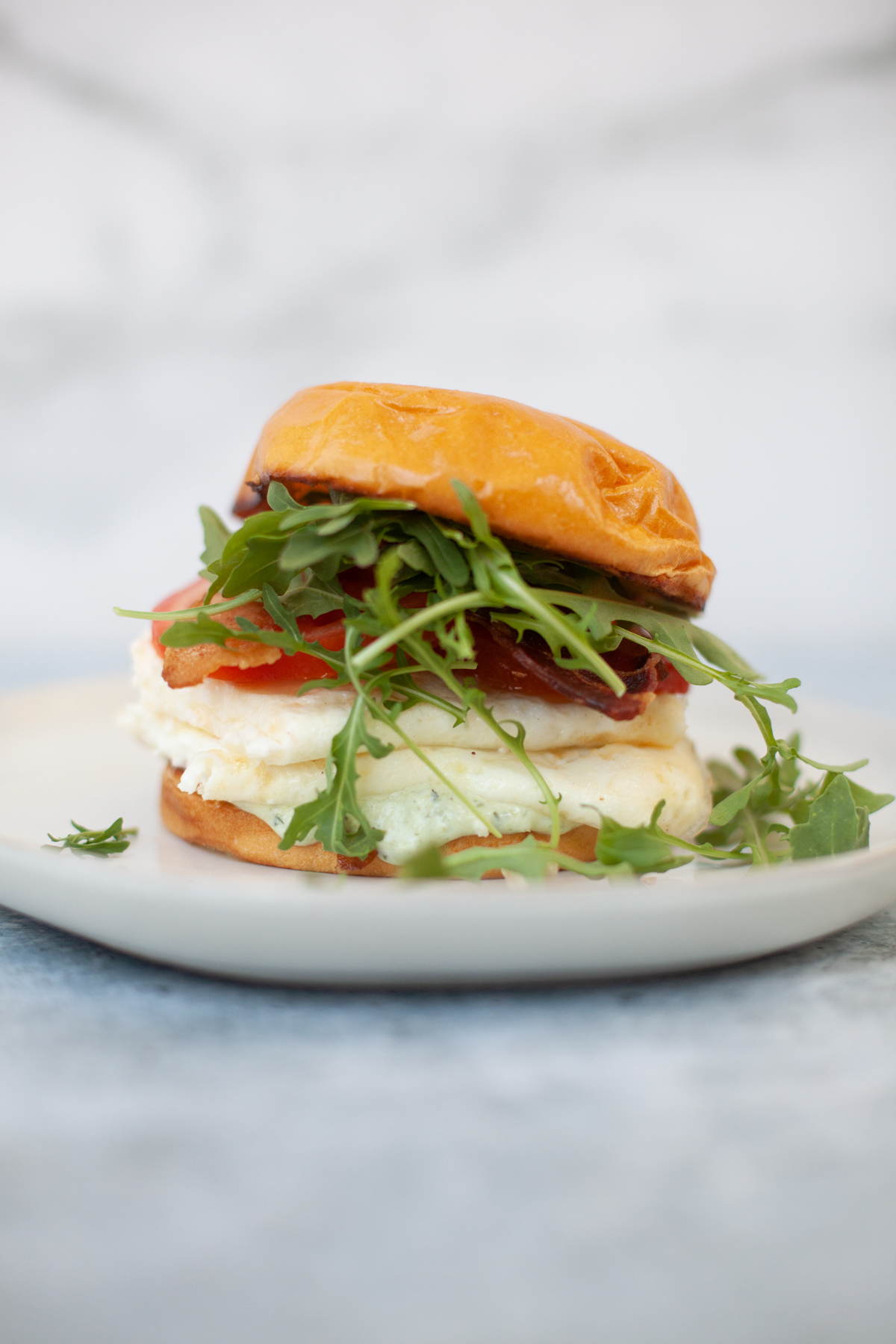 Quick tuscan egg white sandwich on a plate.