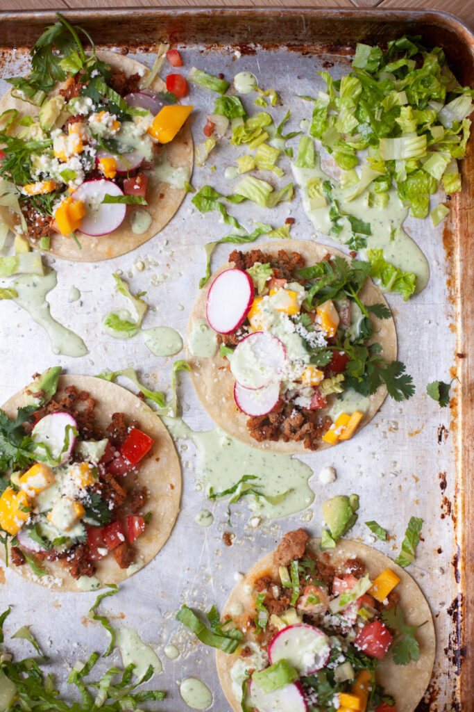 sheet pan tacos with creamy cilantro lime ranch recipe from www.lillieeatsandtells.com