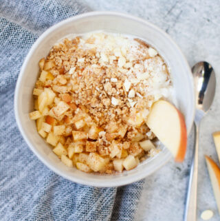 Macro friendly apple crisp yogurt and cottage cheese bowl with toppings.