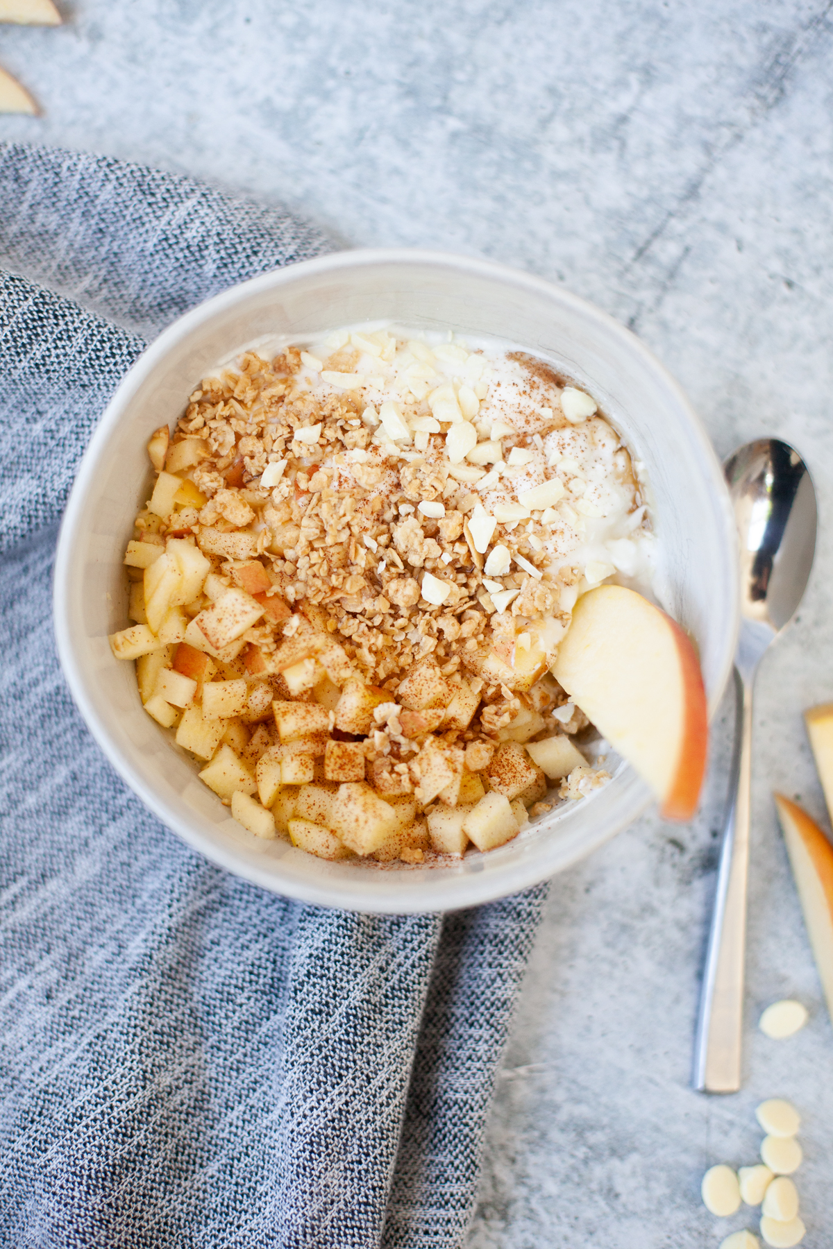Macro friendly apple crisp yogurt and cottage cheese bowl with toppings.