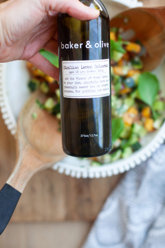 baker and olive white balsamic vinegar served on a peach chopped caprese salad by www.lillieeatsandtells.com