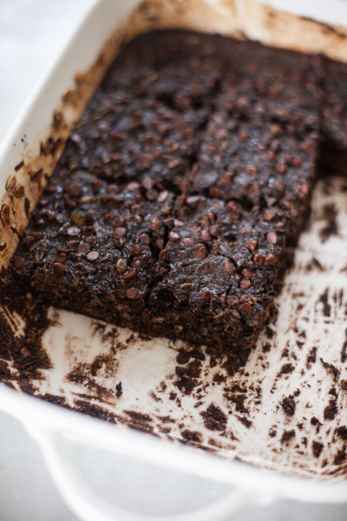 Half a pan of brownie batter squash oats in 9x13 pan.