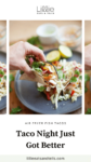An air fryer fish taco on a gray plate with wedges of lime, with text overlay, "Taco Night Just Got Better."