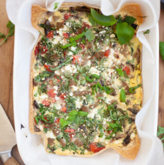 Garden Veggie Quiche for One in a white dish | recipe by www.lillieeatsandtellscom.bigscoots-staging.com