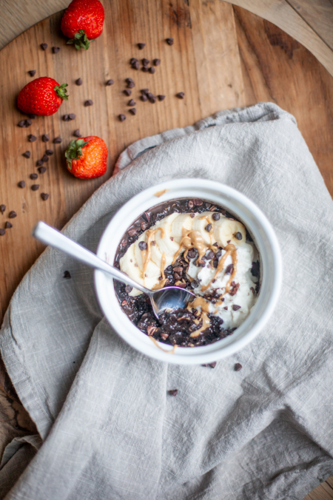 Microwave zucchini brownie oats with toppings.