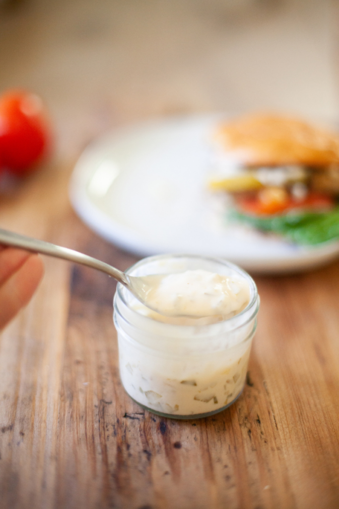 Burger sauce in a small glass jar.