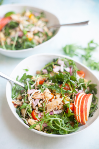 Share this macro-friendly arugula barley salad with lemon and parmesan. www.lillieeatsandtells.com