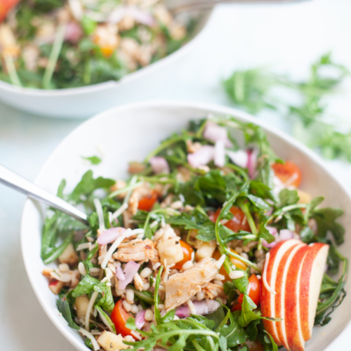 Share this macro-friendly arugula barley salad with lemon and parmesan. www.lillieeatsandtells.com