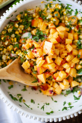 close up of diced peaches in a salad