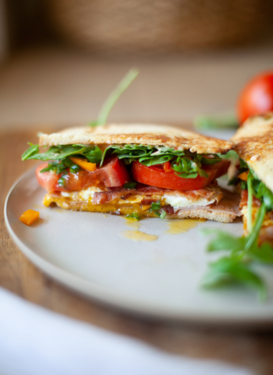 Fried egg blt on plate.