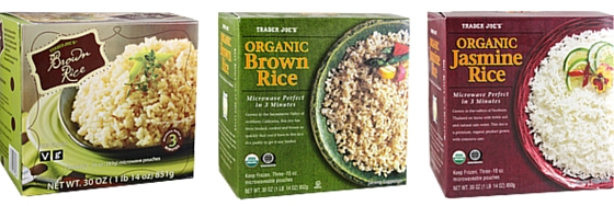 Three boxes of frozen rice from Trader Joe’s—Brown Rice, Organic Brown Rice, and Organic Jasmine Rice—each showing rice served on a plate or bowl on the packaging. These are truly some of My Favorite Trader Joe’s Products for quick and delicious meal prep.