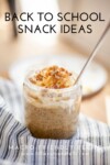 A jar of chia pudding topped with nuts and sliced bananas sits on a striped cloth, making it a perfect choice for back to school snacks. Text reads Back to School Snack Ideas. Macro-Friendly Recipe. www.lillieeatsandtells.com.