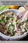 A bowl of chopped salad with chicken, apples, herbs, and red onion, mixed with dressing. Wooden salad servers are in the bowl. Text above reads: 5 Secrets to Amazing Macro-Friendly Salads.