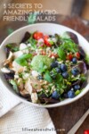 A colorful salad with grilled chicken, blueberries, cherry tomatoes, greens, nuts, and a green dressing in a white bowl; text reads 5 Secrets to Amazing Macro-Friendly Salads—perfect inspiration for anyone looking to create delicious macro-friendly salads at home.