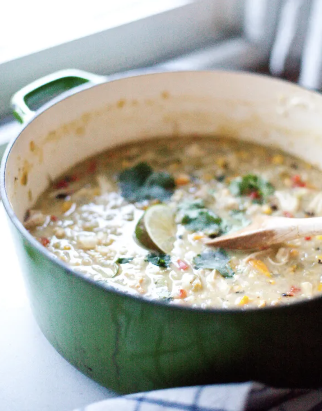 Bowl of One Pot Skinny White Chicken Chili. Lillieeatsandtells.com